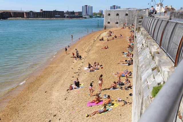 People flocked to the Hot Walls in Old Portsmouth on Thursday, May 21 - the hottest day of the year. Picture: Sarah Standing (210520-8798)