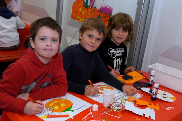 Matthew Stevens, Ethan Barrett and Jacob Barrett get creative in the Halloween craft marquee at Chatsworth House in 2009.