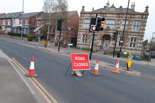 A road closed sign on Burngreave Road, Sheffield, some distance ahead of the police cordon