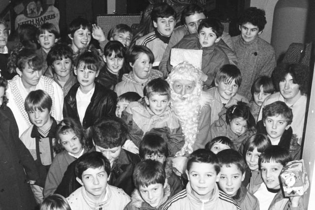 Father Christmas surrounded by Chipsters with their gifts for other children in 1986. Can you spot someone you know?