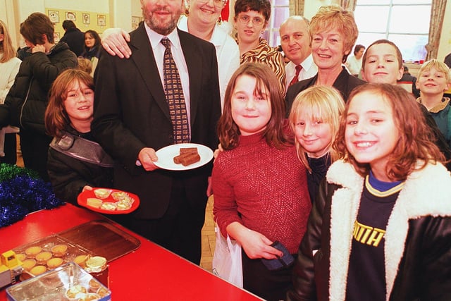 Shortly after official opening the Bracken Hill Primary School Christmas Fair, Secrerary of State for Education Right Hon. David Blunket MP with pupils, staff and event Organisers took a look at the cake stall in 1999