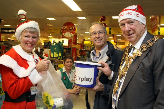 Morrisons at Brampton welcome Fairplay team to bag pack in 2011. Jill Thompson, Chairman at Fairplay is pictured with checkout assistant Kay Hart, customer David Barton and Mayor of Chesterfield Peter Barr.