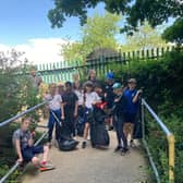 Lydgate Junior School Y5 students working with Tapton students on a local area litter pick