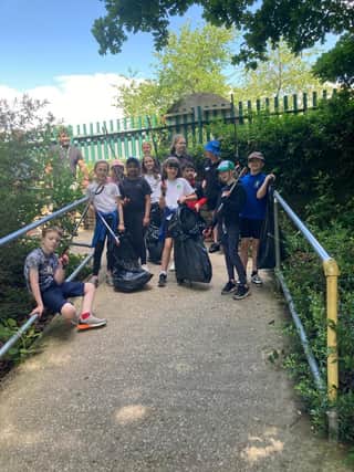Lydgate Junior School Y5 students working with Tapton students on a local area litter pick