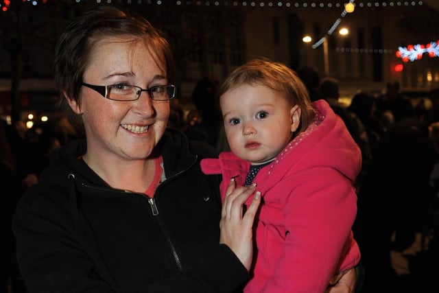 Kerry Parsons and her daughter Faith Gorman (23 mths), from Paulsgrove watch the fireworks at the Christmas lights switch on in Commercial Road in 2009.  
Picture: Ian Hargreaves  (094172-11)