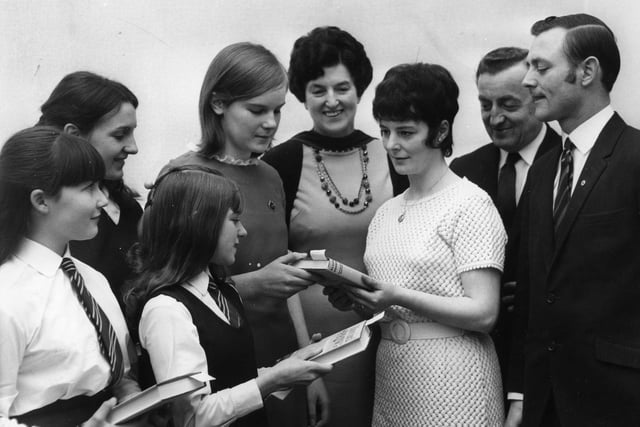 Mrs R Hunter, presents the head girl of Westoe County Secondary Girls' School, Denise Maughan, with her award at speech day. Left to right are: Susan Gates, Alyson Young, Alison Tait, headmistress; Ina Keir, Councillor G H Forster, vice chairman of the school governors and Councillor Hunter.