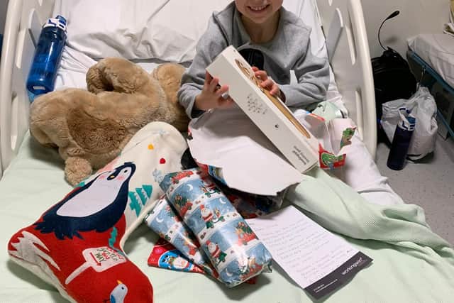 Oliver Dawe, then aged five, spent Christmas Day 2019 in hospital as he awaited surgery for a brain tumour (Picture: Brain Tumour Research)
