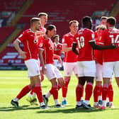 Barnsley's Carlton Morris celebrates with team mates after scoring the only goal of the game against Rotherham United. (Photo by Jan Kruger/Getty Images)