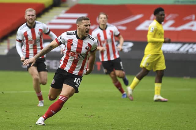 Sheffield United's Billy Sharp celebrates after scoring his side's opening goal from the penalty spot (Gareth Copley/Pool via AP)