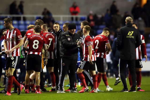 Sheffield United manager Chris Wilder (centre) speaks to Ben Osborn during the FA Cup fifth round match at the Madejski Stadium, Reading: Nick Potts/PA Wire.