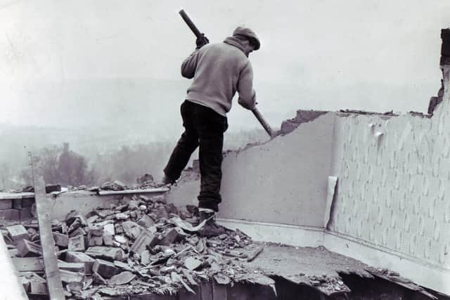 Sheffield Hurricane damage 16th February 1962
A workman starts demolition work at Brightside Vicarage in Firth Park Avenue, Sheffield, where Mrs Shirley Margaret Hill, wife of the vicar, the Rev Colin Hill, was killed during the gale. The vicarage was so badly damaged it was beyond repair.