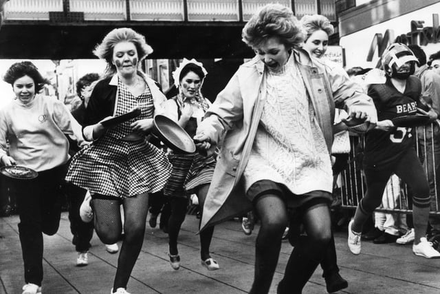 The annual pancake race makes its way down King Street in 1988.