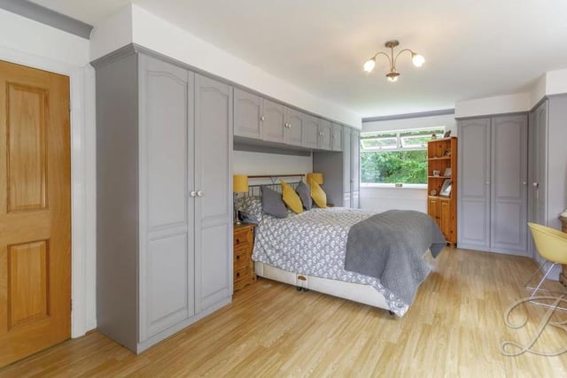 The first bedroom is a great size. It boasts laminate flooring, fitted wardrobes and triple-aspect windows.