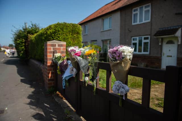 Flowers outside the house in which a 12 day old baby was mauled to death by a dog near Doncaster, South York., September 17 2020.