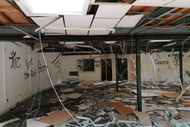 The exposed, vandalised mess of one of the rooms at the back of the Round House which was student accommodation.
The security boards have been repeatedly  torn down.