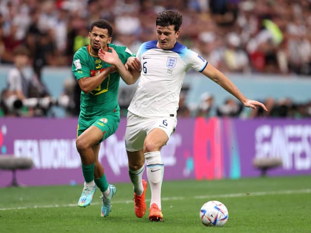 Harry Maguire of England battles for possession with Iliman Ndiaye of Senegal. Both made their professional debuts for Sheffield United: Julian Finney/Getty Images