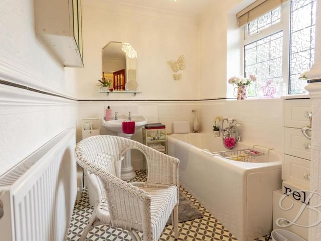 Quaint is the word we would use to describe the family bathroom. It comprises a bath with rinser, low-flush WC, pedestal wash basin, central-heating radiator and opaque window to the side of the bungalow.