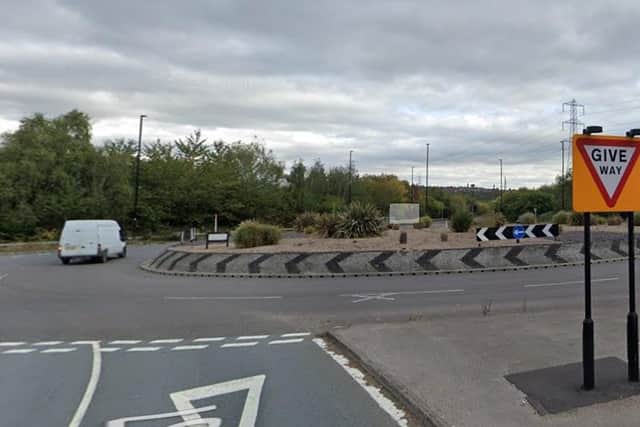 A lorry spills bags of coal at the roundabout on Beighton Road