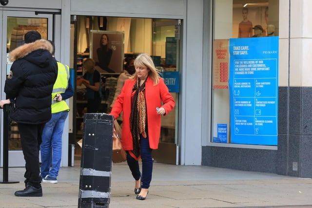 Shoppers carried bags as retail returned. Shoppers outside Primark as Doncaster was put tier three restrictions today.. Picture: Chris Etchells