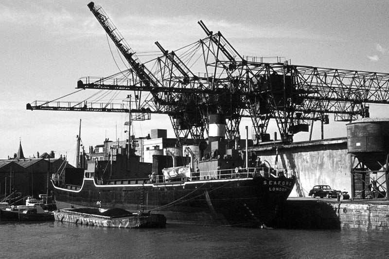 Cranes and collier Seaford registered in London in the Camber
There can't be many people who can remember the cranes working in the Camber unloading coal from a collier. Picture: Graham Stevens.