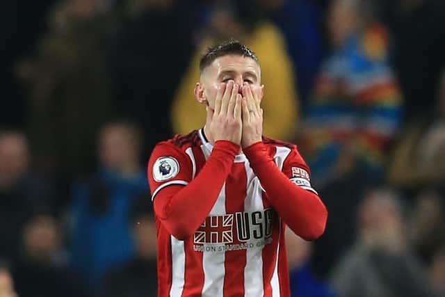 Sheffield United's English-born Northern Irish midfielder Oliver Norwood reacts after missing a chance during the English Premier League football match between Manchester City and Sheffield United at the Etihad Stadium in Manchester, north west England, on December 29, 2019. (Photo by Lindsey Parnaby / AFP) / RESTRICTED TO EDITORIAL USE. No use with unauthorized audio, video, data, fixture lists, club/league logos or 'live' services. Online in-match use limited to 120 images. An additional 40 images may be used in extra time. No video emulation. Social media in-match use limited to 120 images. An additional 40 images may be used in extra time. No use in betting publications, games or single club/league/player publications. /  (Photo by LINDSEY PARNABY/AFP via Getty Images)