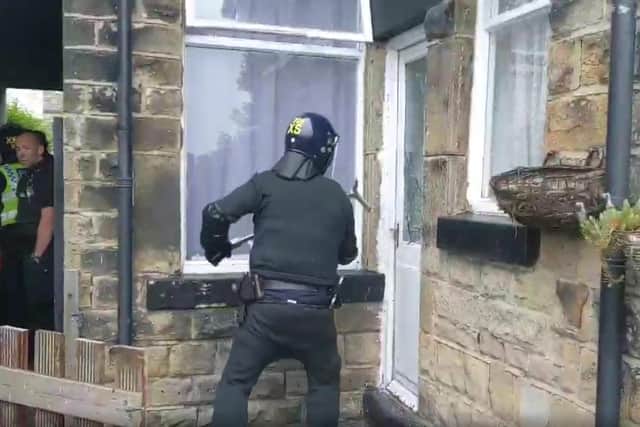 Police raid a home on City Road in Sheffield