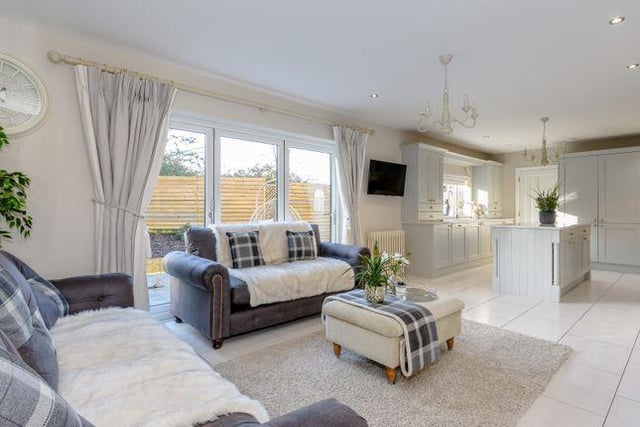 Sitting room with bi-fold doors into the garden, this elevated position offers views over Oakerthorpe.