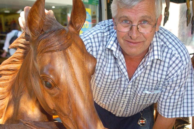 Richard Gyles, of Angela's Craft Collection, sell fair trade carvings at Doncaster's continental market. Richard is pictured with a stunning horse carving from Ubbad in Bali