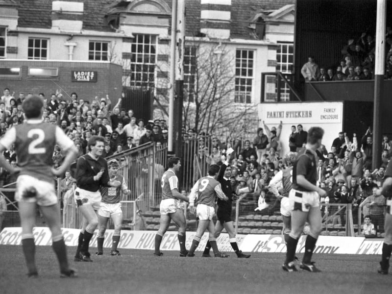 Hibs' Gordon Rae (no 5) argues but the referee sends him off during the Hearts v Hibs Edinburgh derby football match at Tynecastle in November 1988. Final score 1-1 draw.