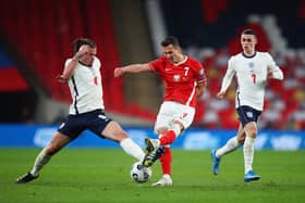 Arkadiusz Milik of Poland is challenged by Kalvin Phillips of England during the FIFA World Cup 2022 Qatar qualifying match between England and Poland on March 31, 2021 at Wembley Stadium in London, England: Catherine Ivill/Getty Images