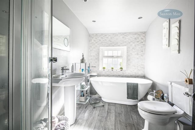 The bathroom looks great and has a modern finish, with the standing bath being the focus of the room.