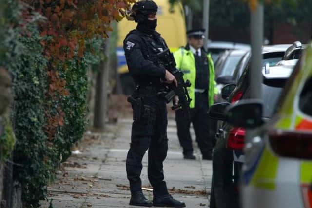 Armed police at an address in Liverpool after an explosion at Liverpool Women's Hospital killed one person and injured another. Photo: PA/ Peter Byrne