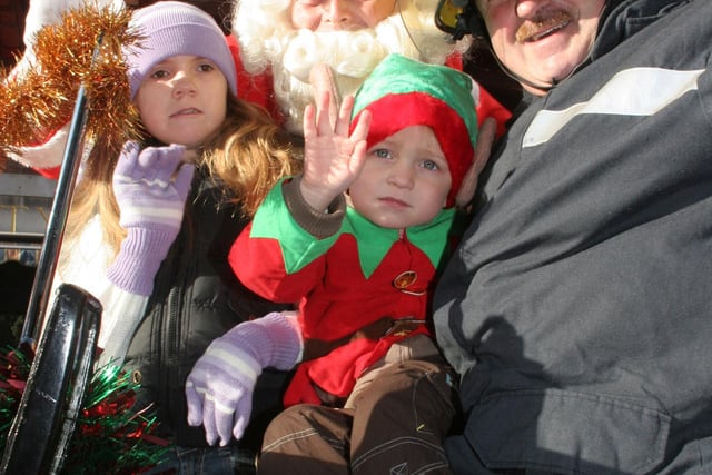 Maisie Lawrence aged 8 with Santa, Owen Blake aged 3 and grandad fire fighter Owen Moran pictured in 2006