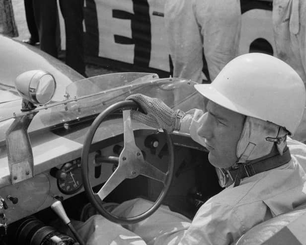 British Formula One racing driver Stirling Moss on a Lister-Jaguar racecar at Silverstone, UK, 21st July 1958. (Photo by M. Stroud/Daily Express/Getty Images)