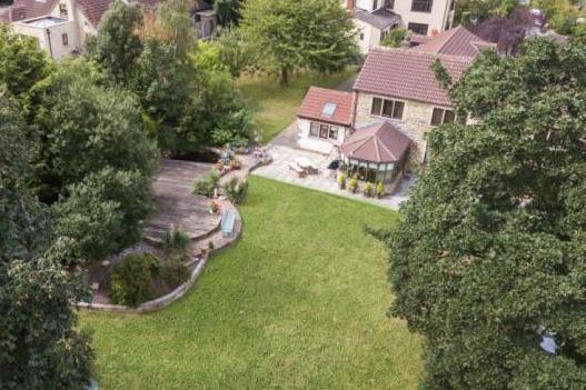 This five-bedroom property on Rotherham Road, Killamarsh, has substantial gardens offering far-reaching views and patio areas that make for superb al fresco dining. The guide price is £525,000 and the sale is being handled by Blundells at Crystal Peaks. (https://www.zoopla.co.uk/for-sale/details/48902204)