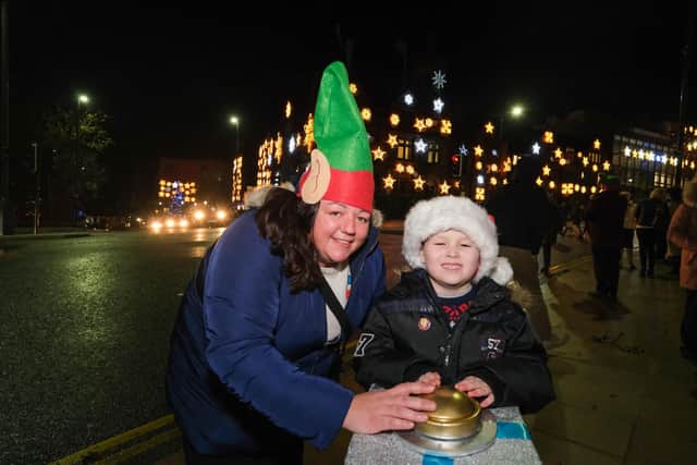 The Children's Hospital Charity turns on the Christmas snowflakes for 2021. Oliver Howe and Amie Greatorex from Morrisons at Ecclesfield perform the switch on.
