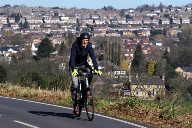 Steve Haake cycling above Lodge Moor