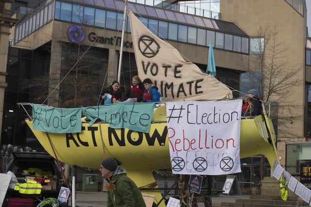 Extinction Rebellion protestors in Barkers Pool before lockdown drawing attention to climate change.