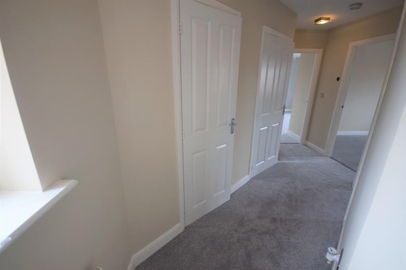 A bright entrance hallway having two handy storage cupboards, UPVC double glazed window, Honeywell heating control, socket point, BT Openreach socket and internal doors to the main rooms.