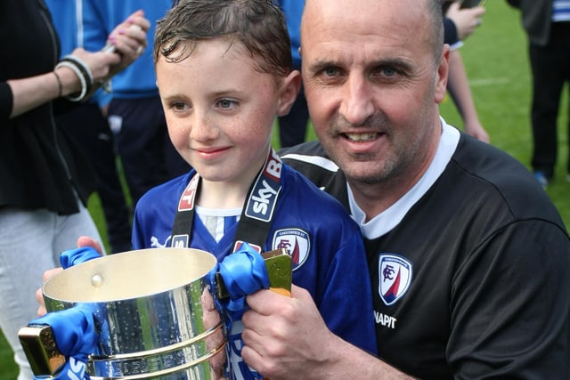 Manager Paul Cook with enjoys time with the trophy.