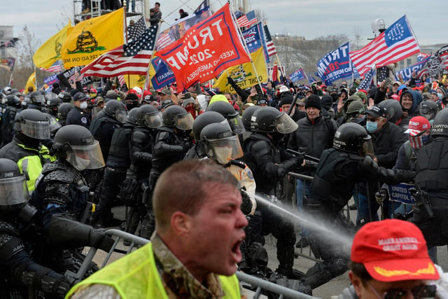 Trump supporters clash with police and security forces as people try to storm the US Capitol in Washington D.C on January 6, 2021. - Demonstrators breeched security and entered the Capitol as Congress debated the a 2020 presidential election Electoral Vote Certification. (Photo by Joseph Prezioso / AFP)