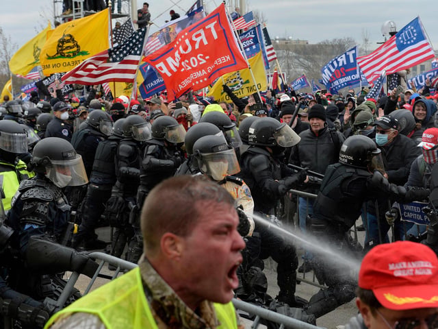 Trump supporters clash with police and security forces as people try to storm the US Capitol in Washington D.C on January 6, 2021. - Demonstrators breeched security and entered the Capitol as Congress debated the a 2020 presidential election Electoral Vote Certification. (Photo by Joseph Prezioso / AFP)