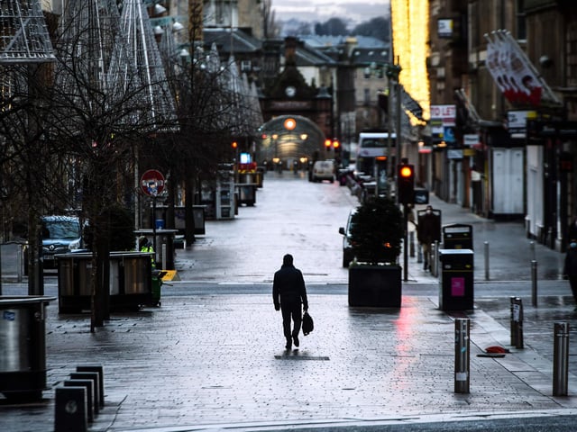 Pedestrians walk through central Glasgow as Britain enters a national lockdown