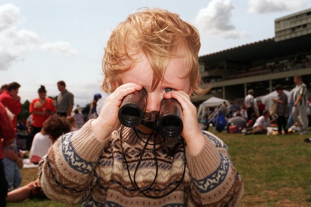 Two-year-old Robert Smith from Rotherham studies the form of the horses at Doncaster Family Race Day in June 1996
