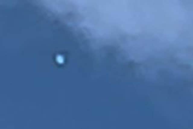 Neil Levesley spotted two mysterious objects in the sky above his home on the triangle estate, in Handsworth, on a Wednesday morning. The picture shows one of them.