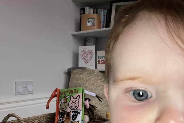 Emilia Barr, aged seven months, on a Zoom call