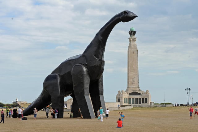 The dinosaur getting some attention on Southsea Common 2nd August 2010.Picture: Malcolm Wells 102445-8758