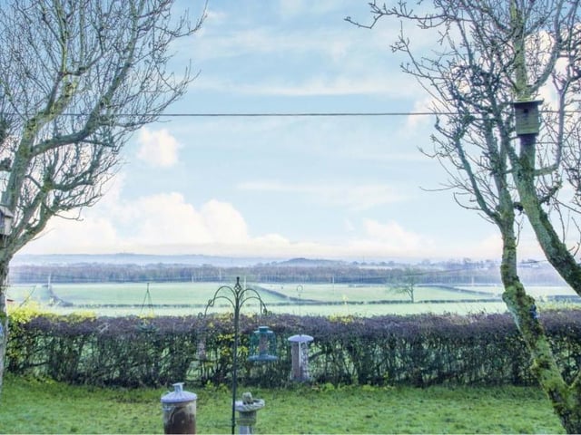 Feast your eyes on this view from the back of the property. Open fields and countryside for as far as you can see.