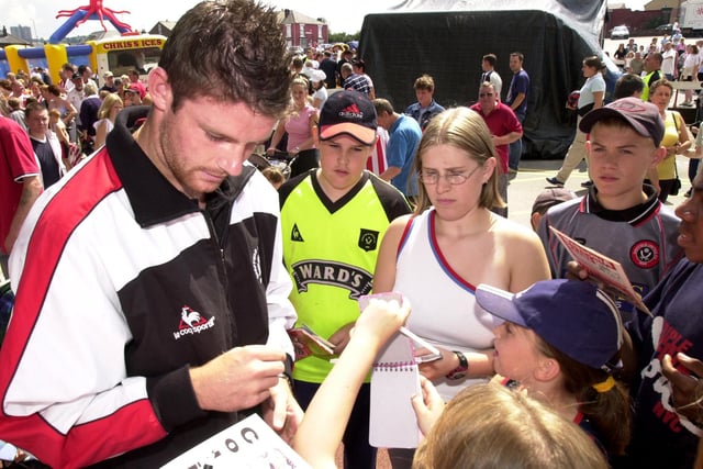 Colin Cryan signs autographs for the fans at the club open day