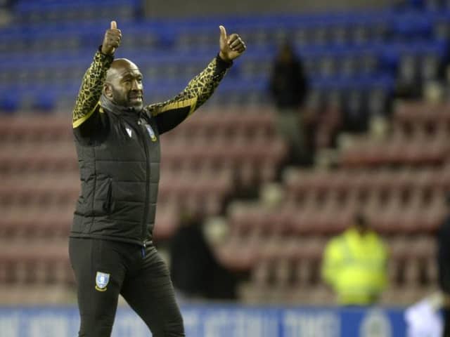 Sheffield Wednesday manager Darren Moore salutes the travelling fans at Wigan Athletic.